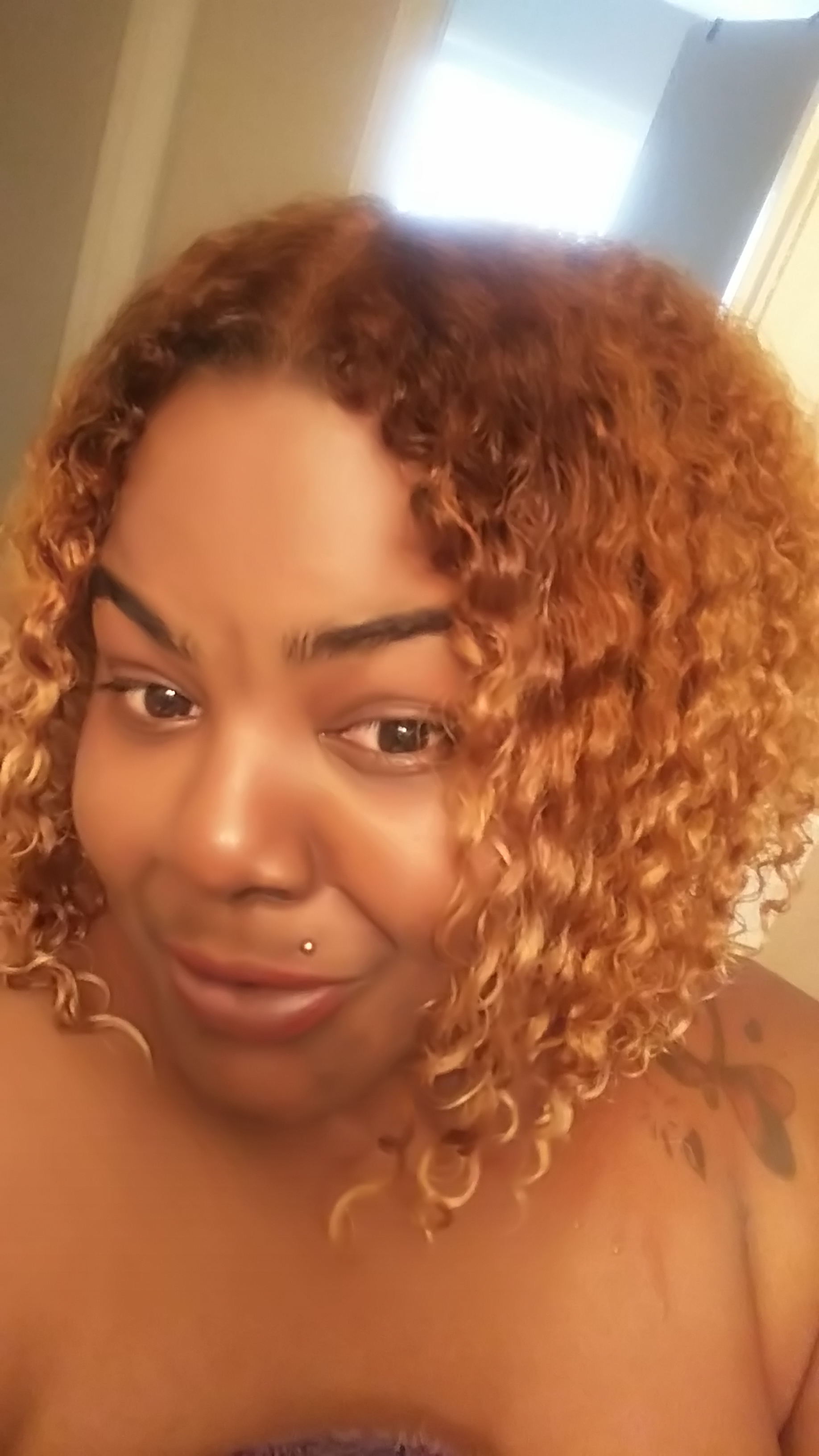 Natural curly hair dyed using Clairol Textures and Tones #7G Lightest Blonde for African American hair.